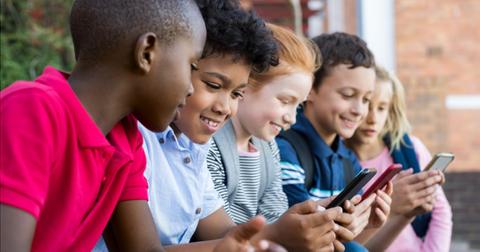 children-using-smart-phone-picture-id950607434-1551972516701.jpg