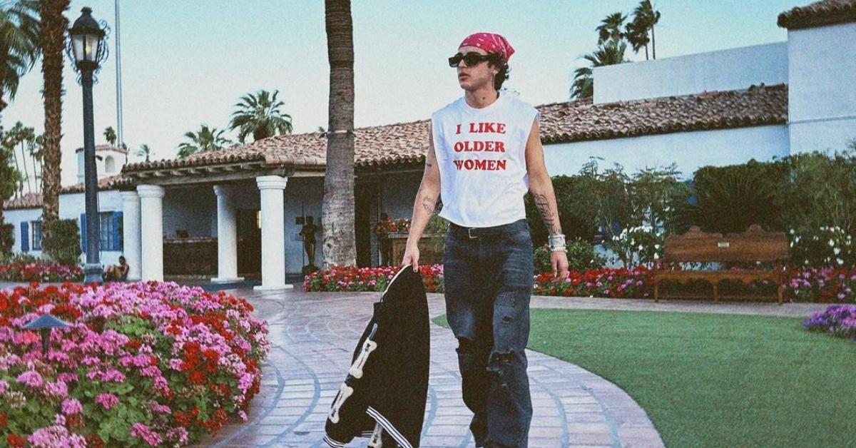 Joao from Too Hot to Handle in front of a house with palm trees