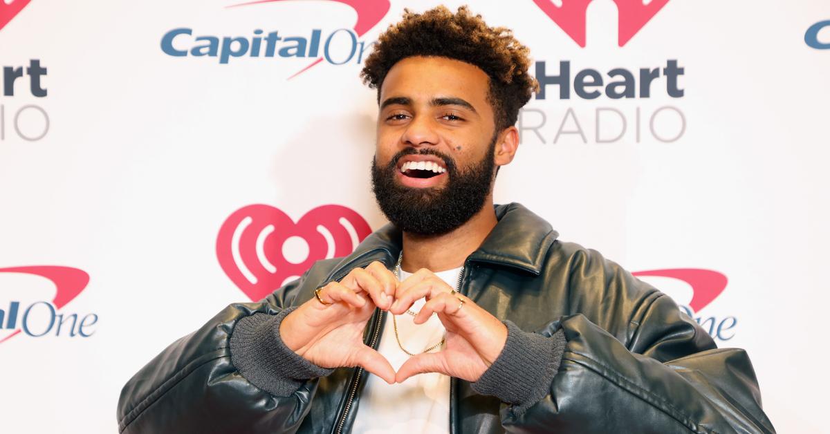 Paul Russell makes a heart with his hands at iHeartRadio 106.1 KISS FM's Jingle Ball 2023 on Nov. 28, 2023 in Fort Worth, Texas