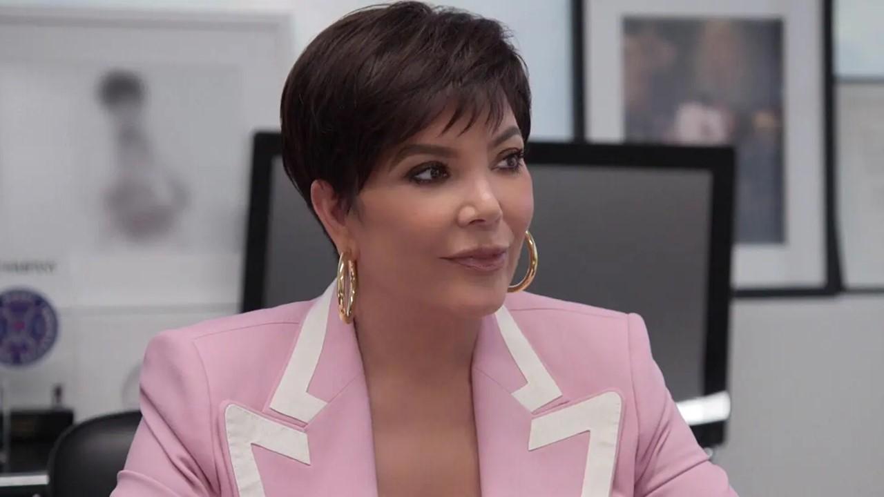 Kris Jenner sitting at a desk in Hulu's 'The Kardashians'