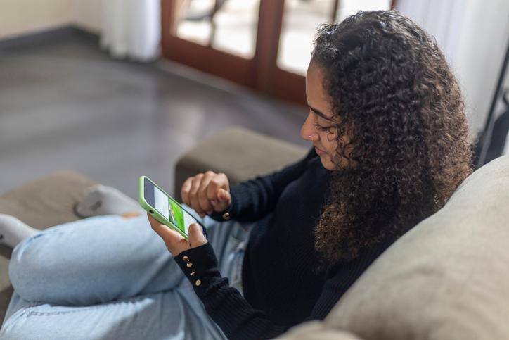 Shot of woman looking at her phone