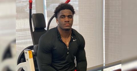 AJ Simon sitting in a gym