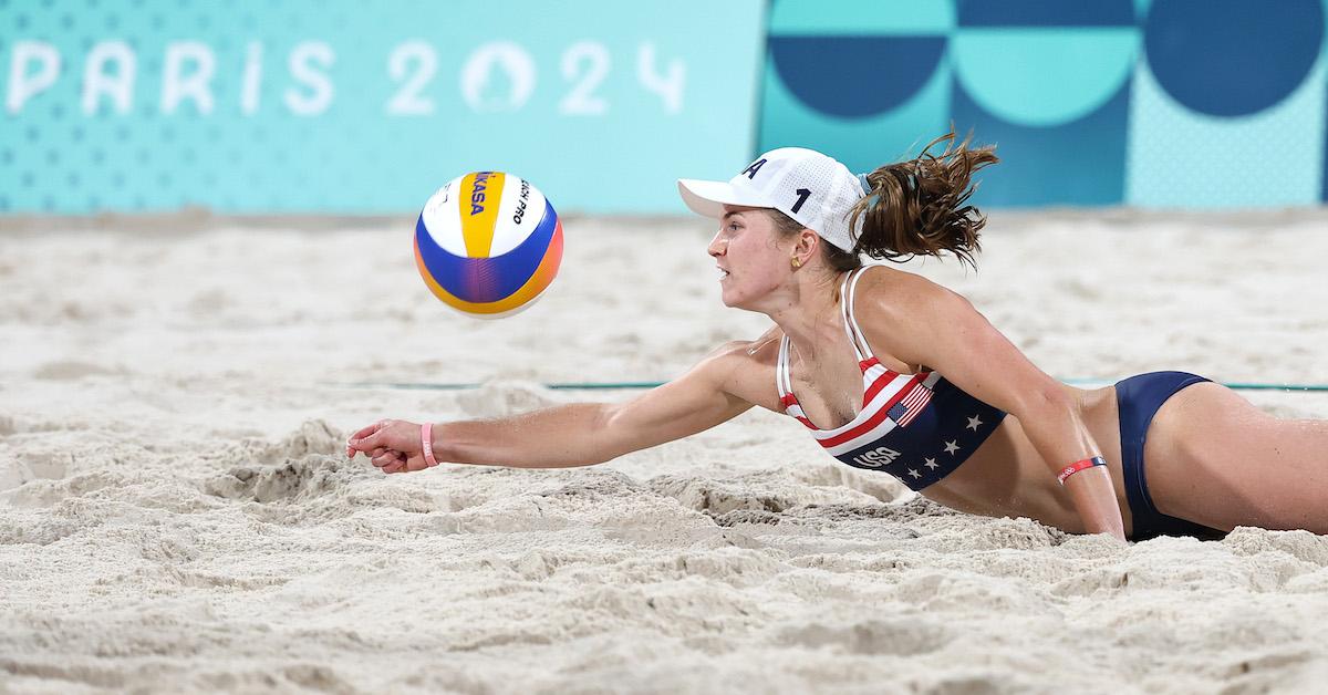 Kristen Nuss of Team United States digs the ball during the Men's Preliminary Phase - Pool C match against Xue Chen and Xia Xinyi of Team People's Republic of China on day six of the Olympic Games Paris 2024 at Eiffel Tower Stadium on Aug. 1, 2024 in Paris