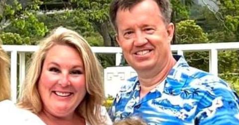 Stephanie and Barry Ellis posing for a family photo.