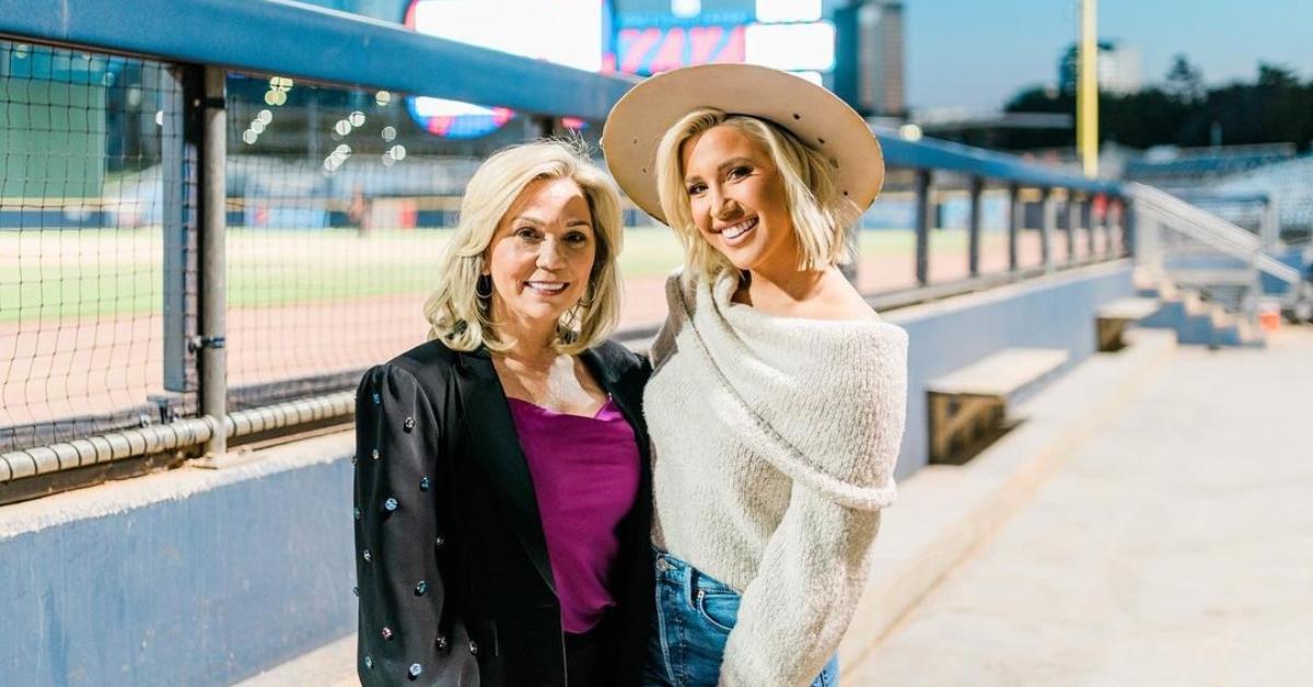 Julie and Savannah Chrisley near a baseball field