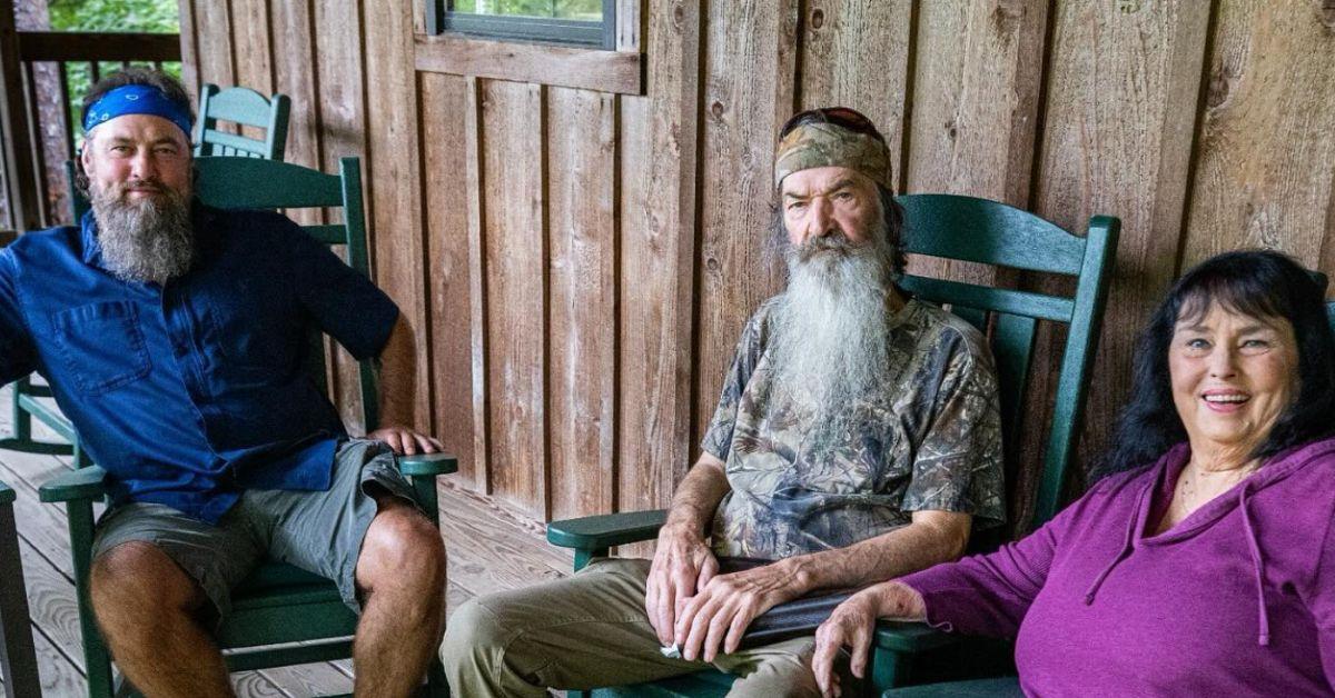 Phil Robertson and his family sitting on his porch.