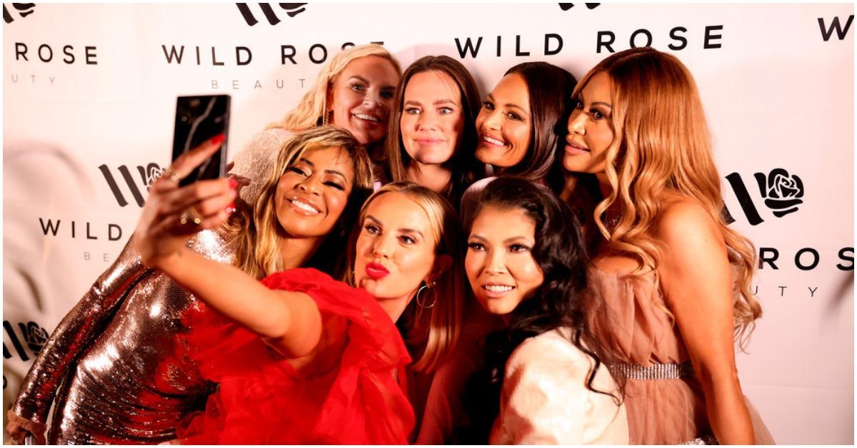 'RHOSLC' Cast members Mary Cosby, Heather Gay, Whitney Rose, Meredith Marks, Jennie Nguyen, Lisa Barlow, Jen Shah posing at an event. 