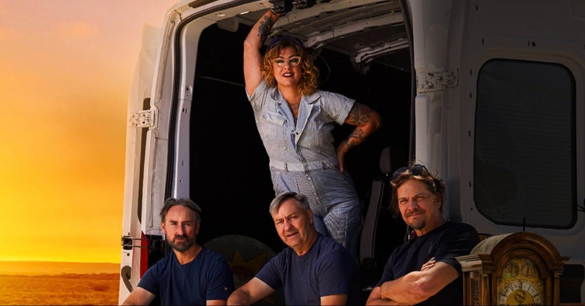 The cast of 'American Pickers' in the back of an open van.