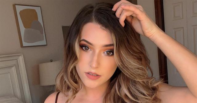 Sweeettails with a hand in her hair.