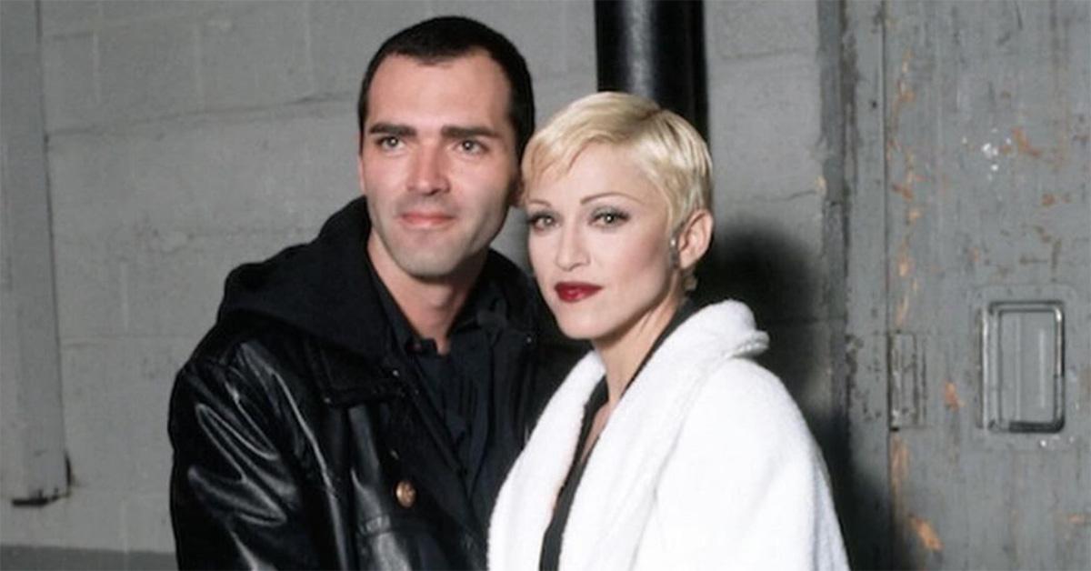 Madonna and Christopher with their heads close. 