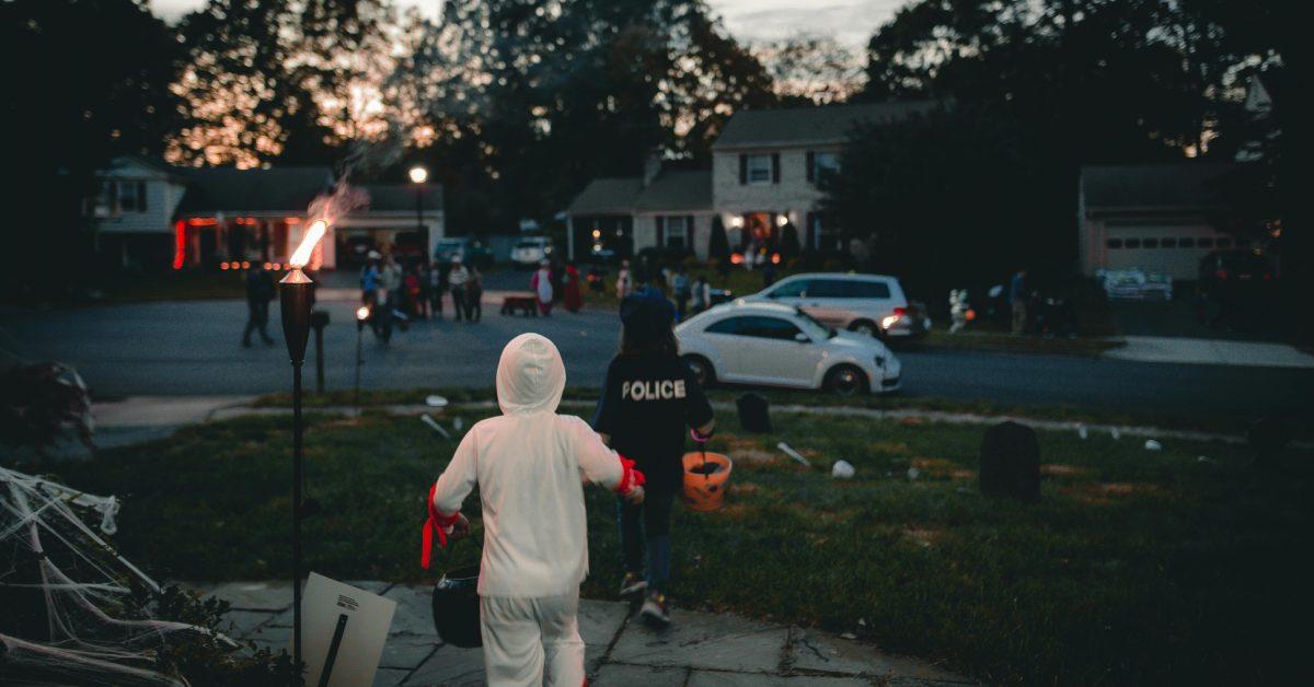 Kids trick-or-treating in a neighborhood.
