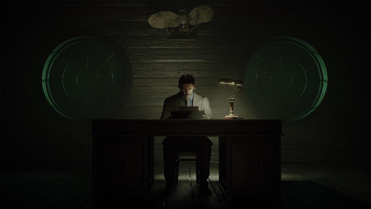 'Alan Wake 2' Alan Wake sitting a desk in front of a typewriter.