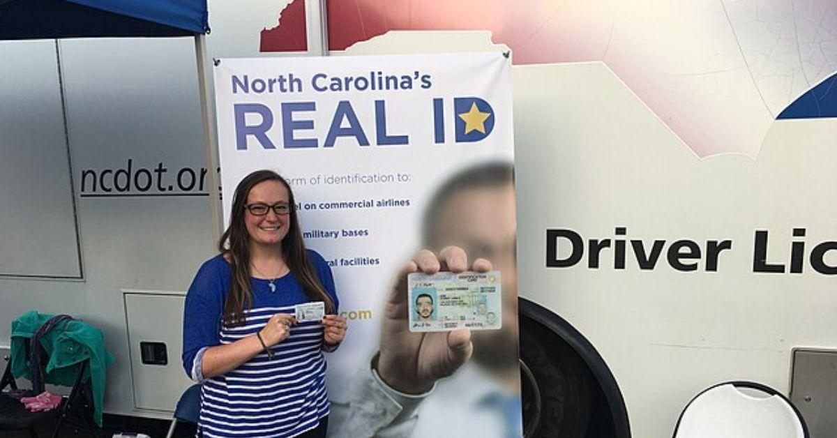 A person holding their Real ID in North Carolina. 