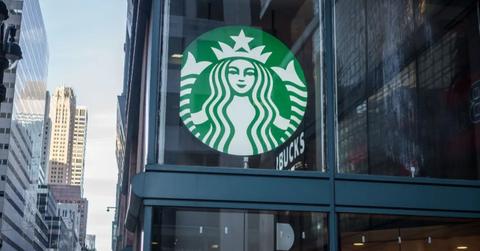A Starbucks sign outside of a New York City location