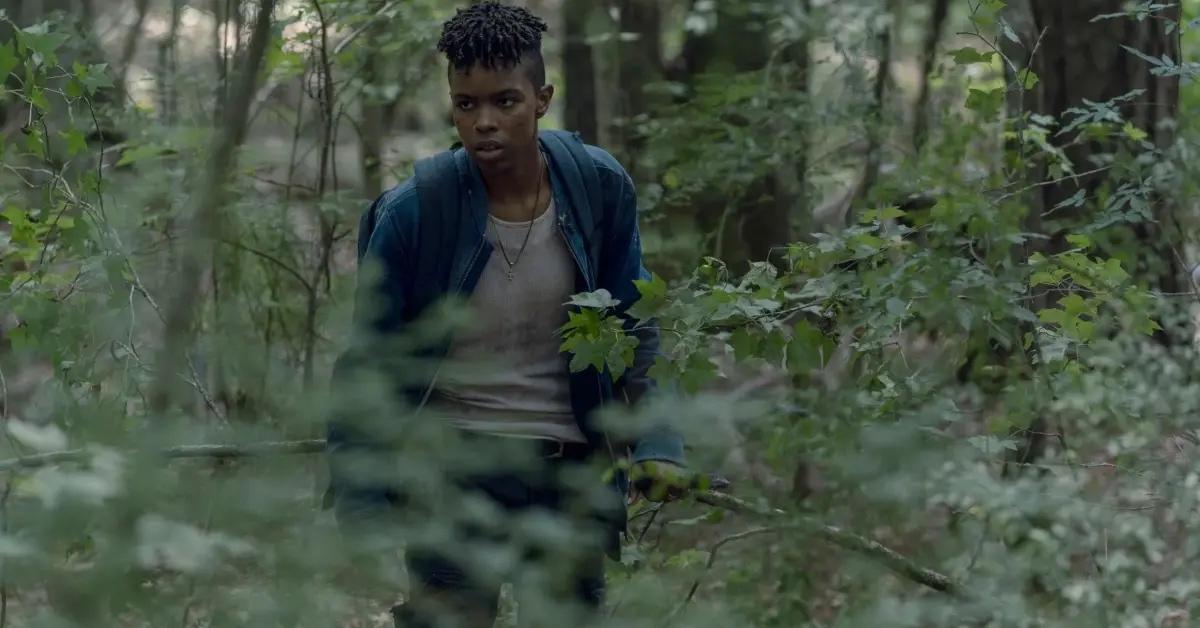 Angel Theory as Kelly in 'The Walking Dead' in the forest.