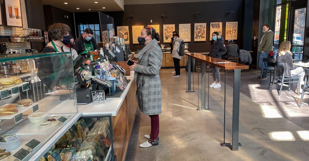 A woman at a Starbucks counter