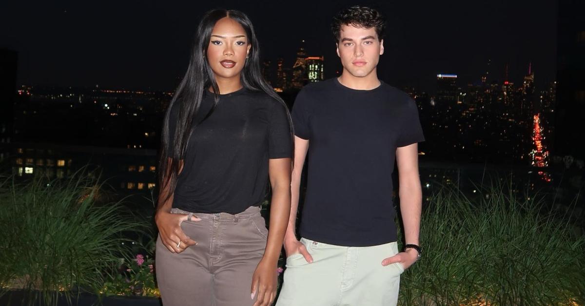 Riley Burruss and Brooks Marks outside on a rooftop patio