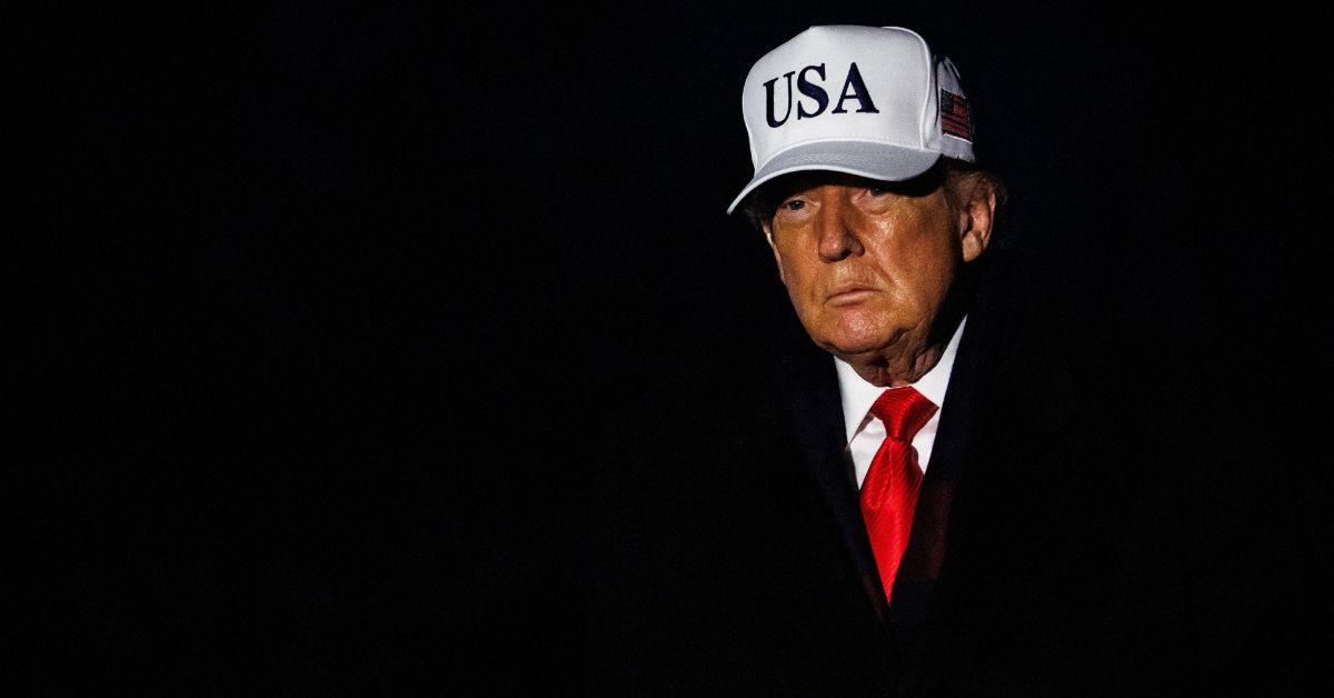 Donald Trump returning to the White House in a USA cap. 