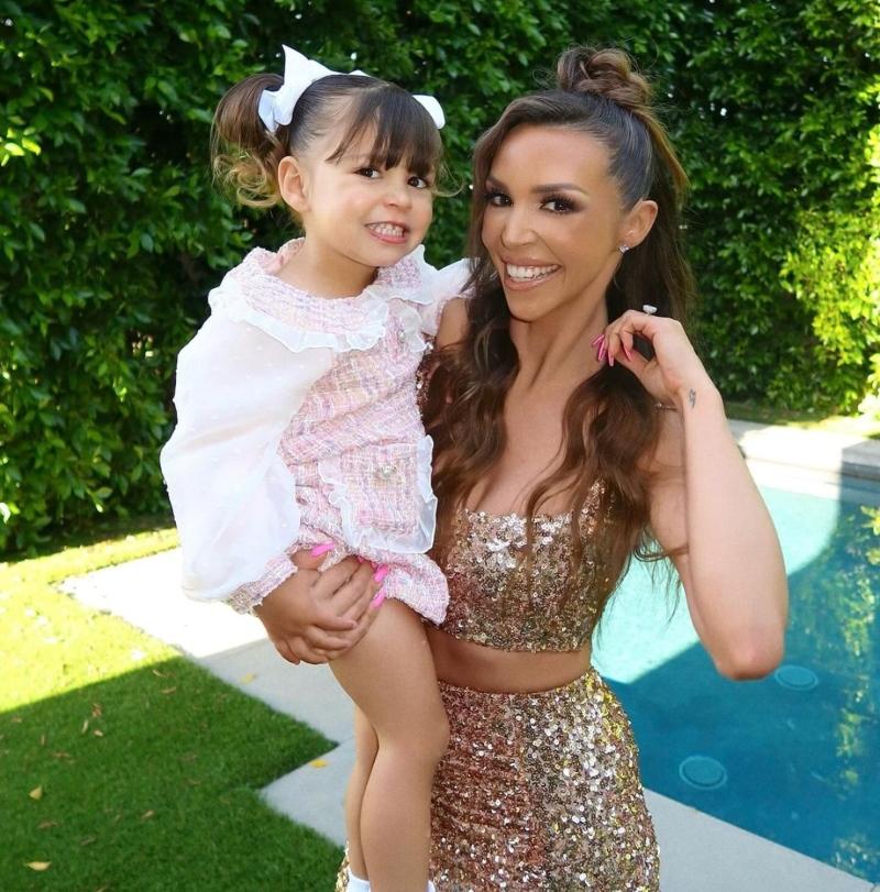 Scheana Shay and her daughter Summer Moon in their backyard by the pool