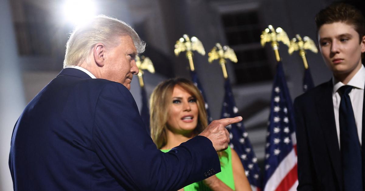 U.S. President Donald Trump (L) gestures, flanked by First Lady Melania Trump and son Barron Trump, on Aug. 27, 2020