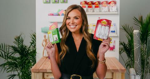 Hannah Brown dons an all-black ensemble while posing with Command Brand products.