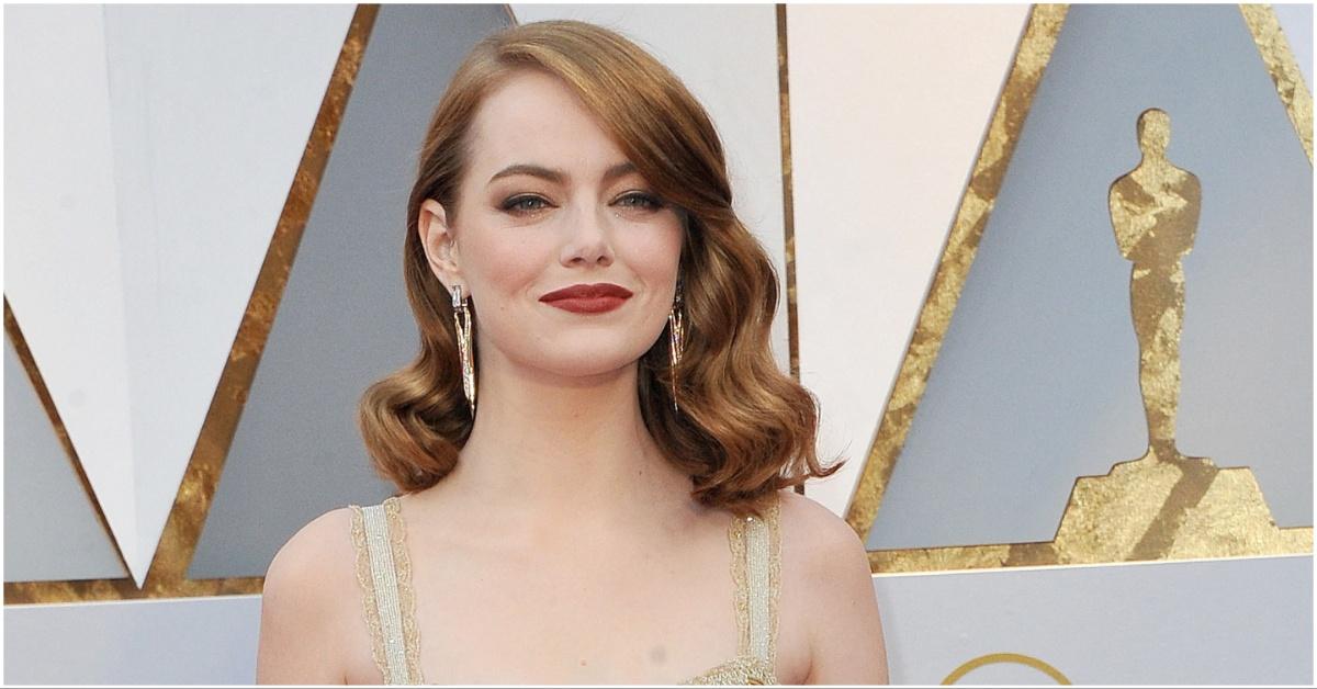 Emma Stone posing at an award ceremony