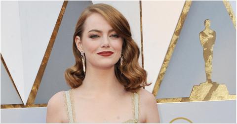 Emma Stone posing at an award ceremony