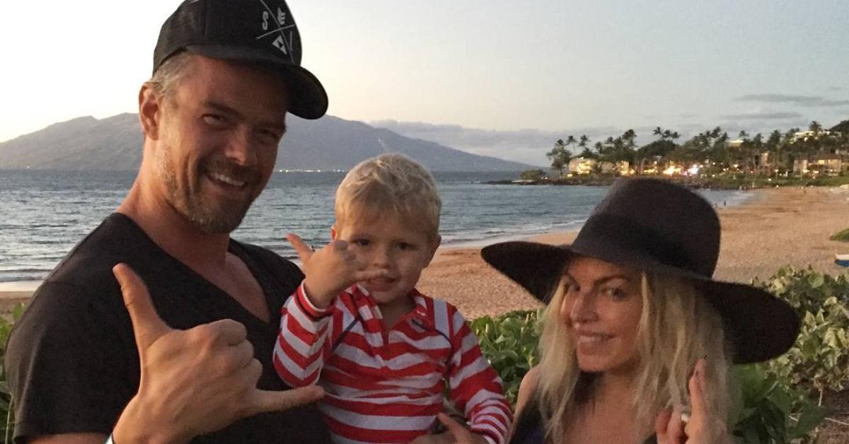 Josh Duhamel, Fergie, and their son on a beach.
