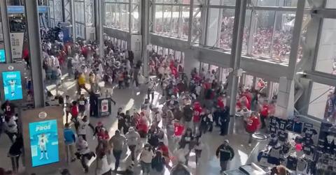 Fans rush into AT&T stadium in 2022.