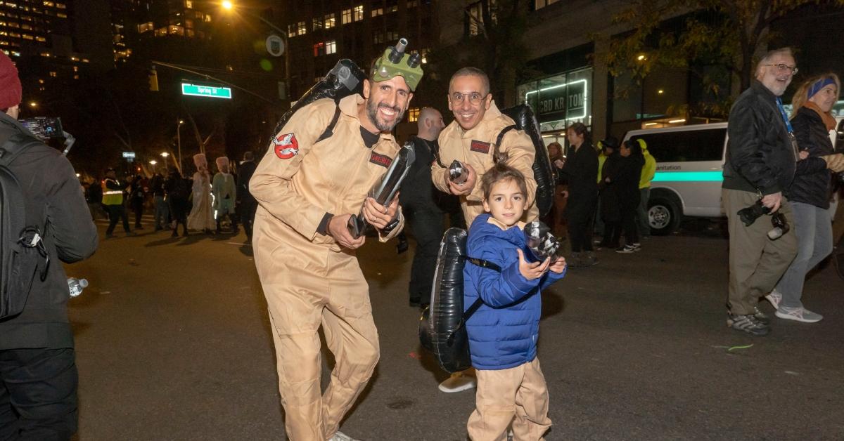 (l-r): A stock photo of a family as Ghostbusters on Halloween
