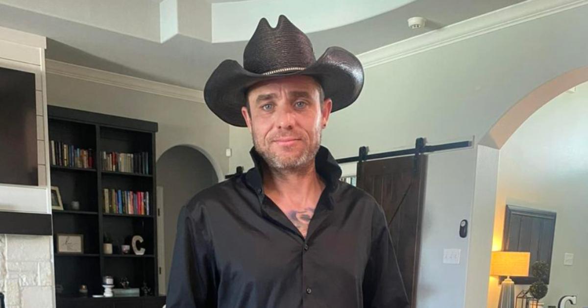 Captain Jake Anderson in his home wearing a cowboy hat.