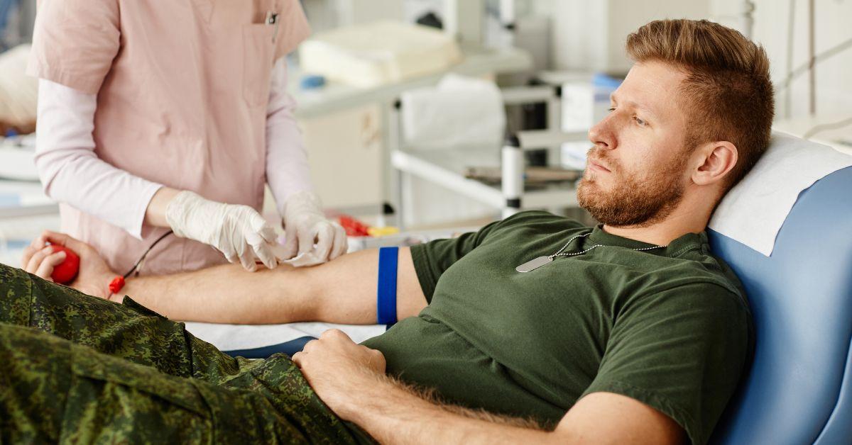 A man getting his blood drawn at a doctors office