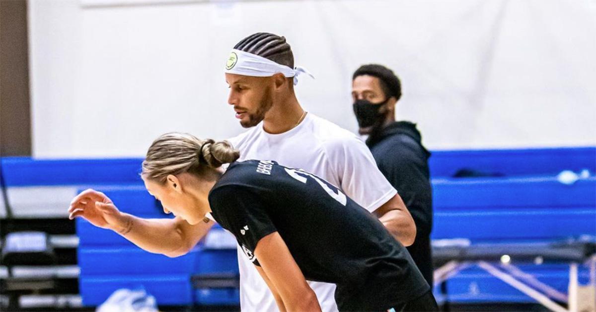 Cameron Brink and Steph Curry working together in the gym. 