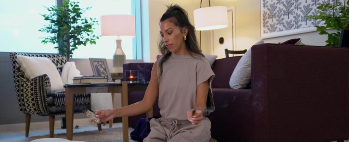 Karla lights sage in her apartment on MAFS