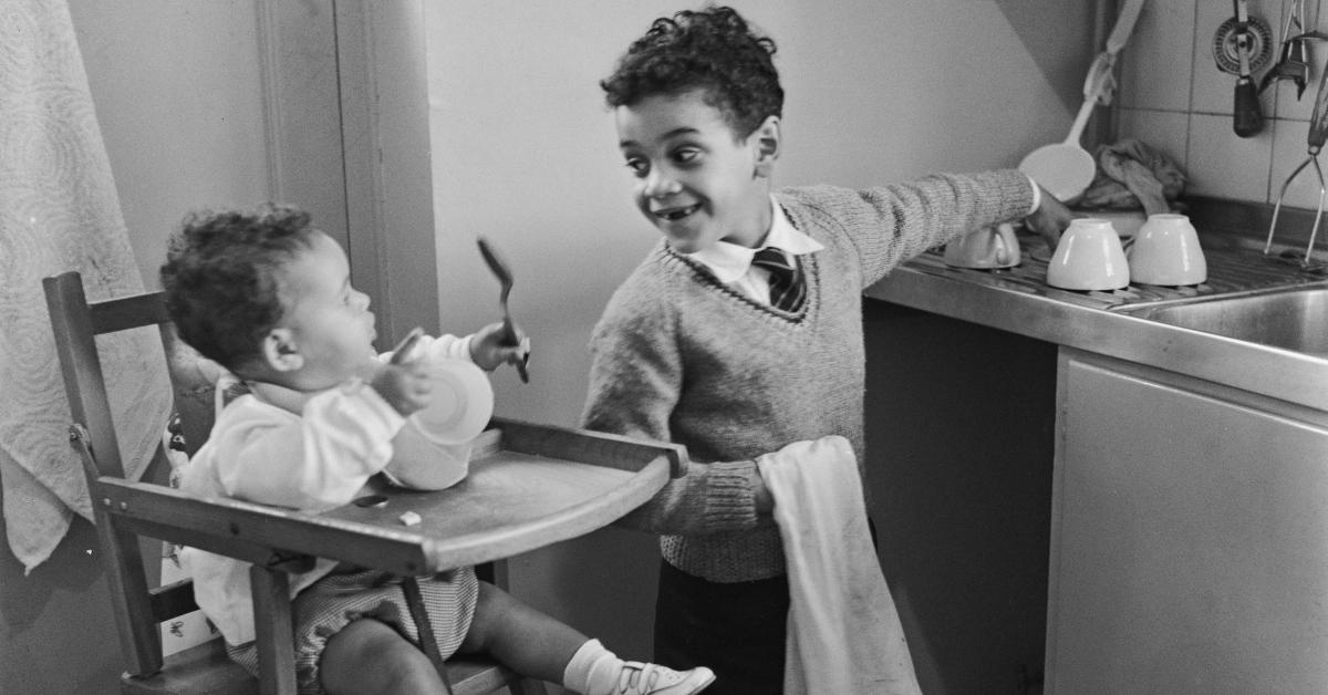 A kid helps with chores