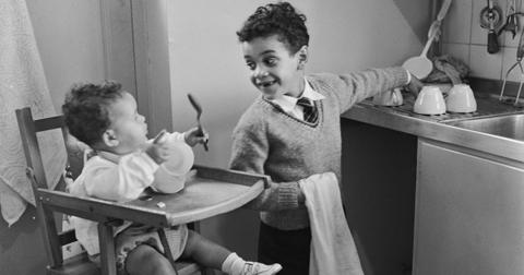 A kid helps with chores
