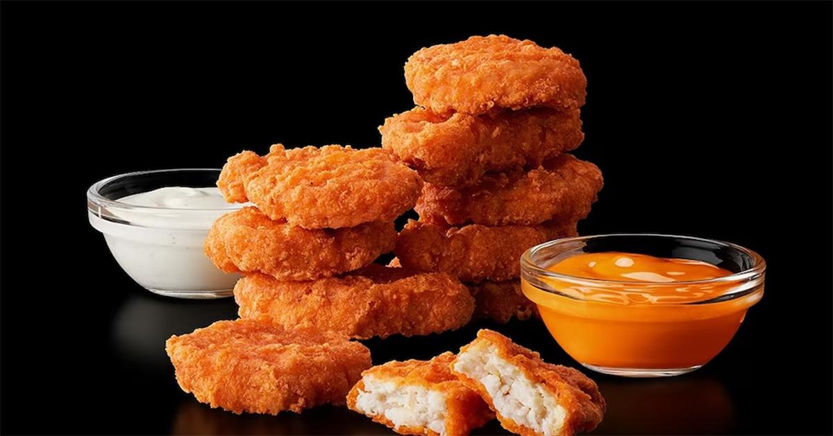 Spicy McNuggets with sauces next to them. 