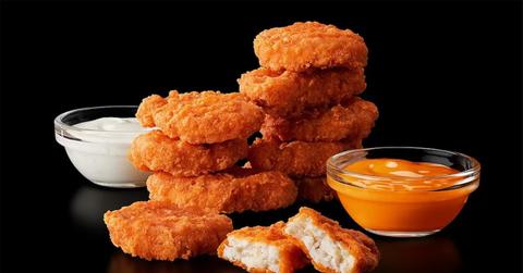 Spicy McNuggets with sauces next to them.