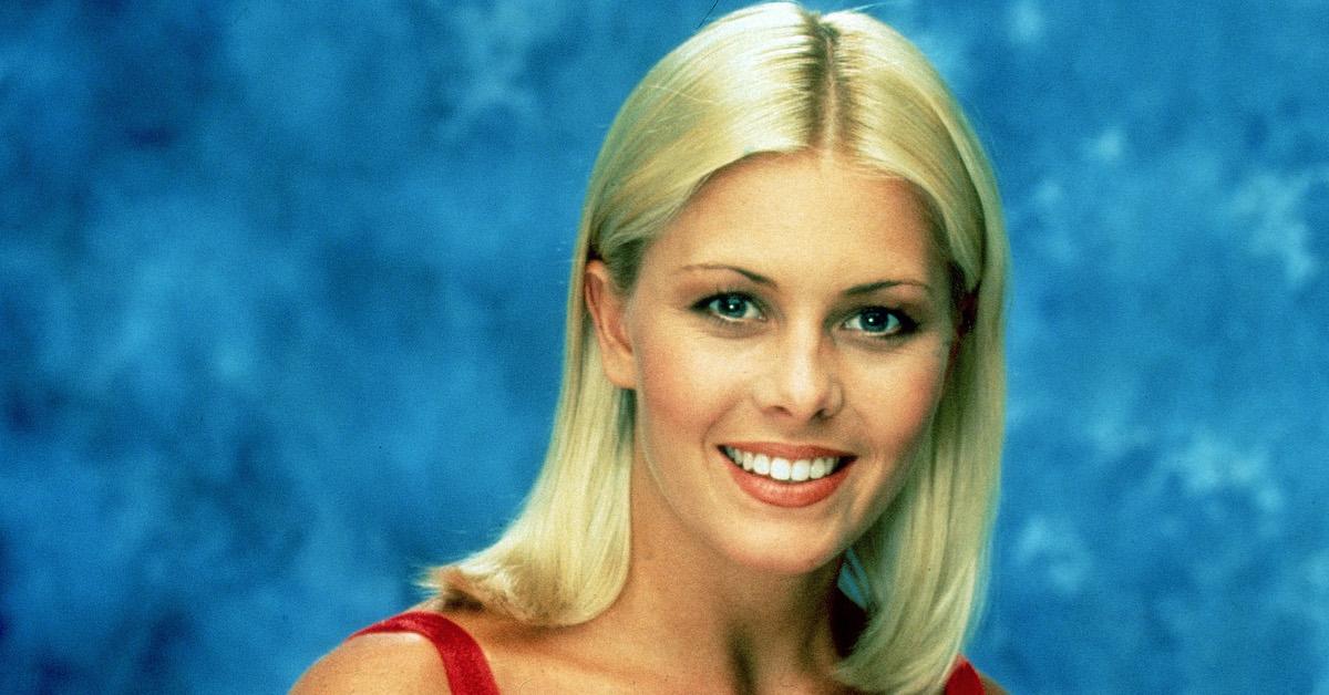 Nicole Eggert, one of the stars of the TV series 'Baywatch,' wearing a low-cut red swimsuit, 1992