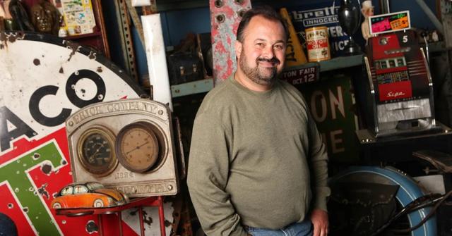 Frank Fritz standing in a garage