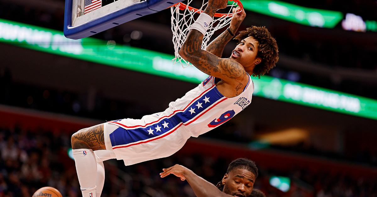 Kelly Oubre Jr. hanging off the rim against the Detroit Pistons. 