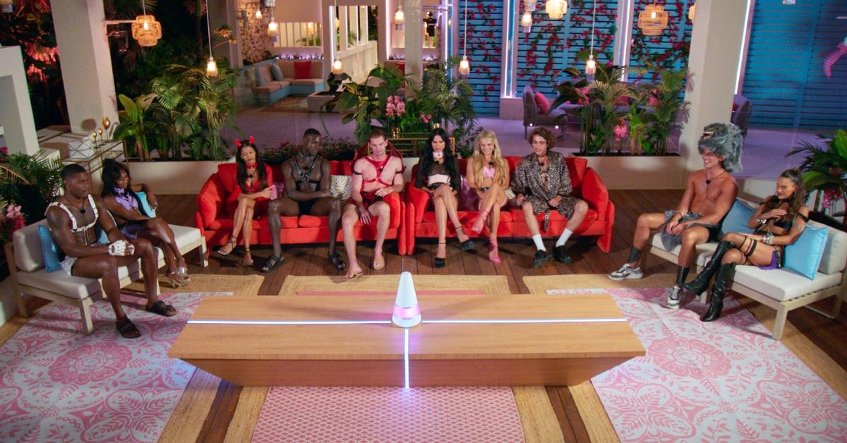 The cast of 'Too Hot to Handle' Season 6 sitting at the cabana listening to Lana.