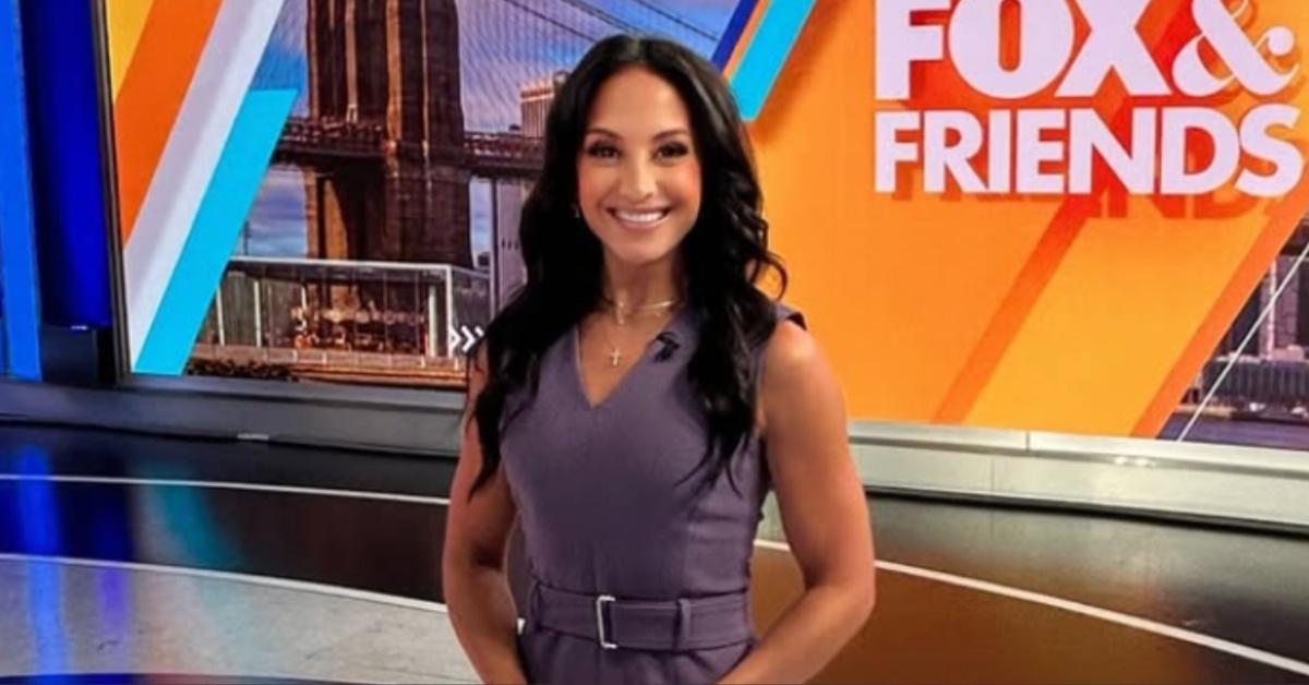 Emily Compagno poses for a picture on the set of Fox & Friends.
