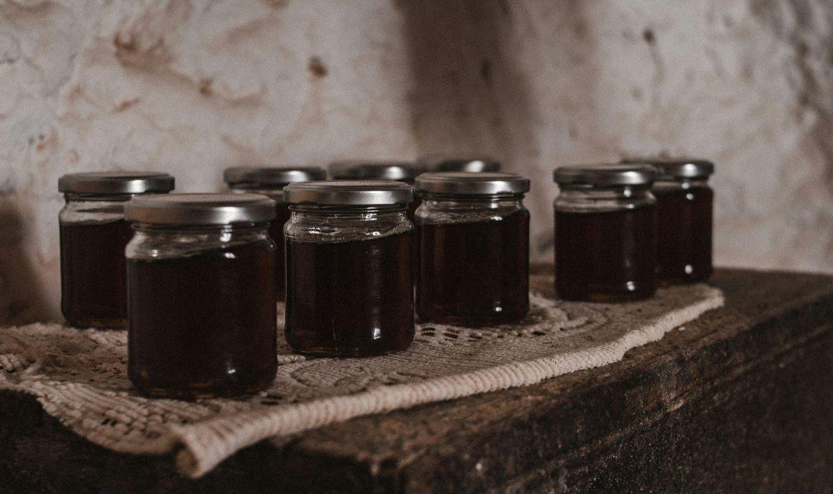 Jars of jam sitting on a table