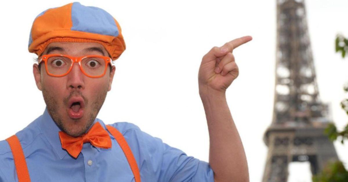 Blippi points to the Eiffel Tower