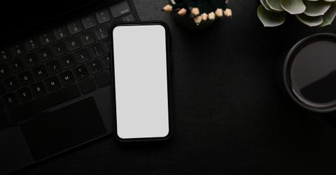 Blank iPhone on a desk.