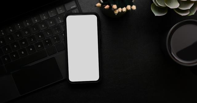 Blank iPhone on a desk.