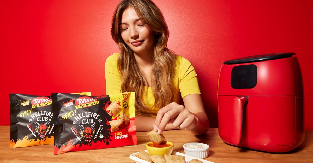 Hellfire Club Totino's Spicy Pizza Rolls on a table with an air fryer