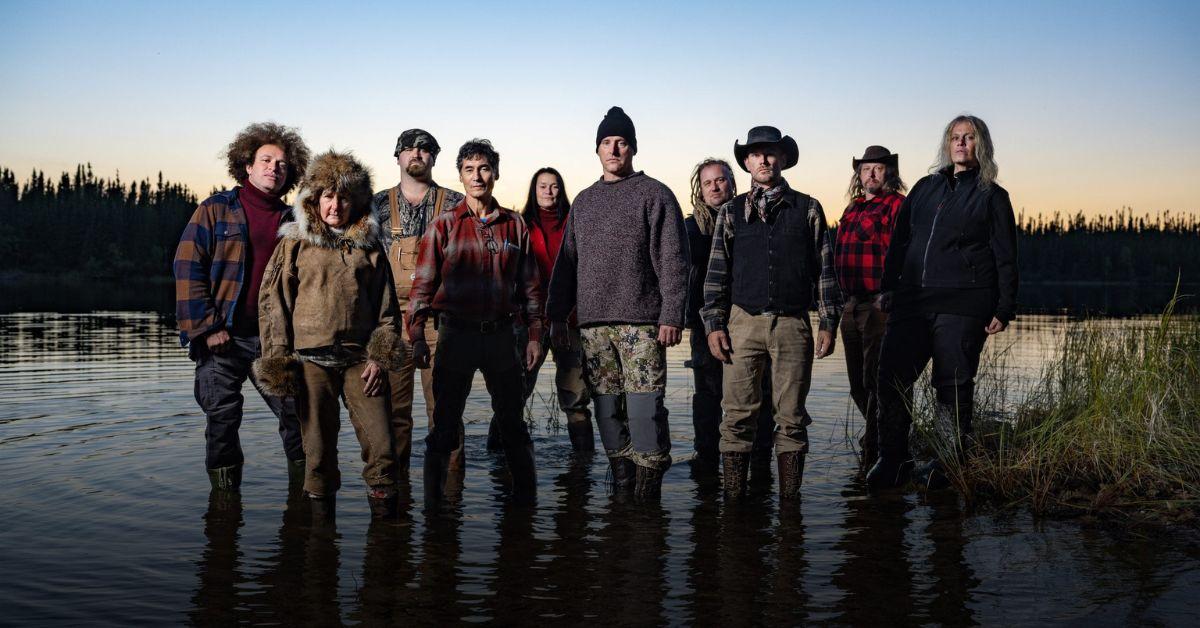 The cast from 'Alone' Season 10 standing in a river