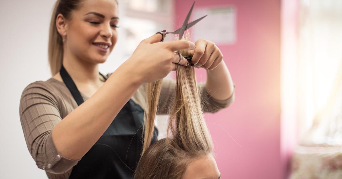 A hairdresser cutting a client's hair